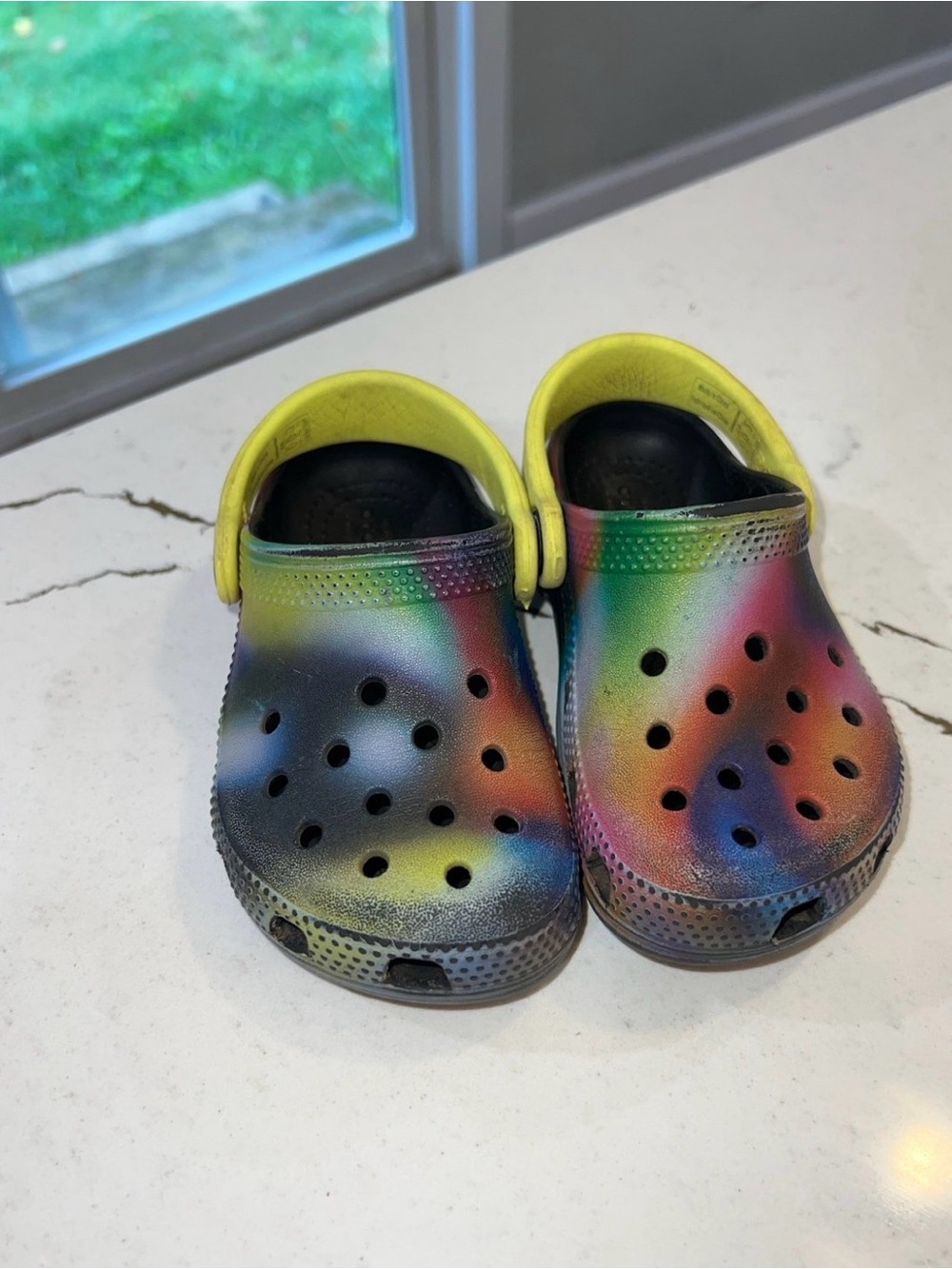 CROCS Kids Rainbow Tie-Dye Clogs with Yellow Heel Strap